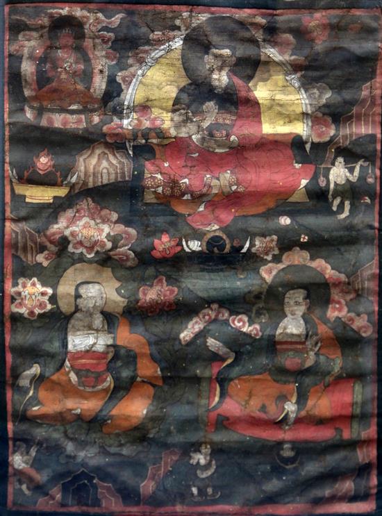 A pair of Tibetan oil on canvas thangkas, 18th/19th century, images 54cm x 40cm excl. silk borders